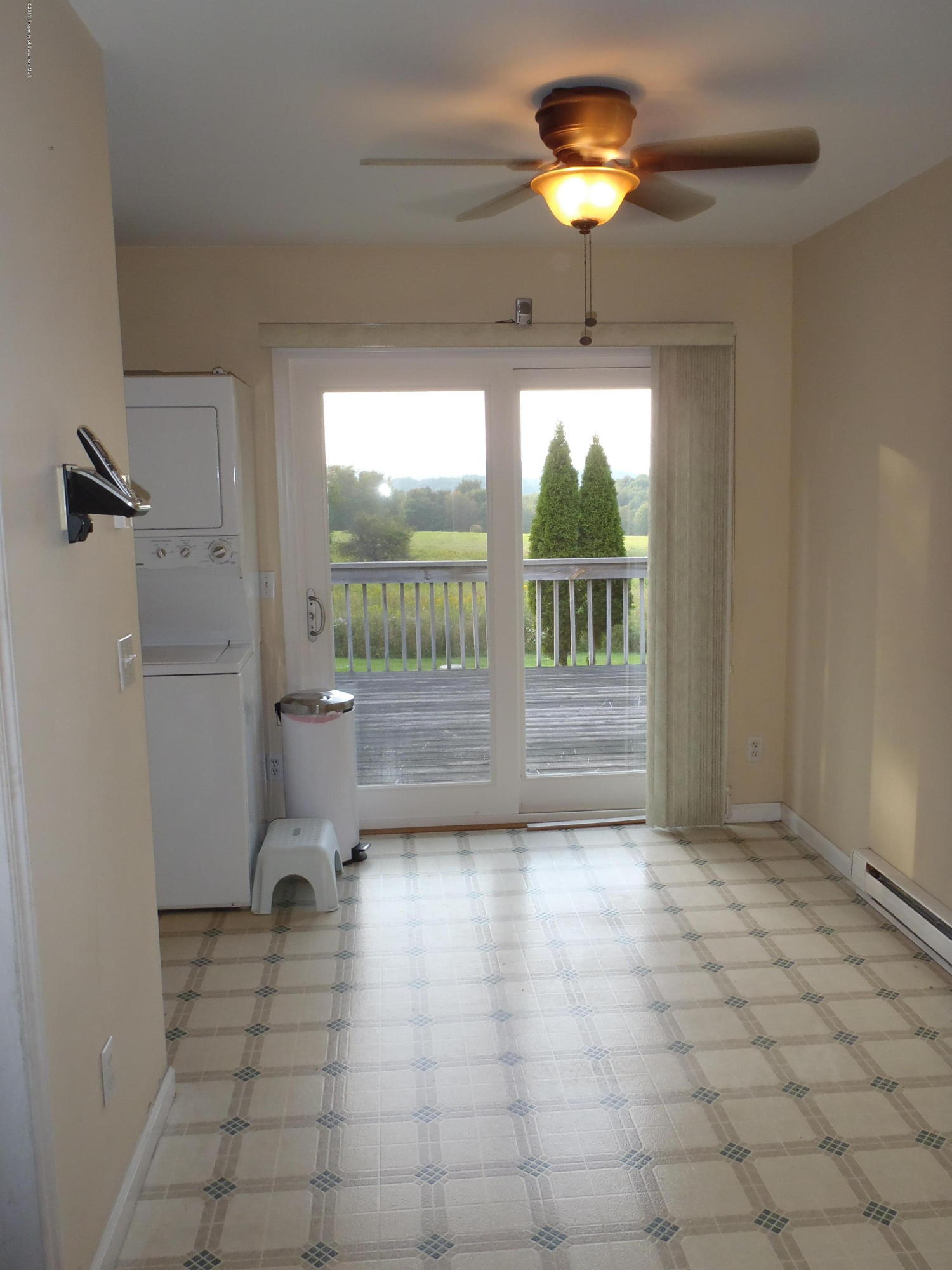 5441 Cottrell Road Union Dale, PA 18470 - Photo 9 of 19 a view of a livingroom with a ceiling fan and window