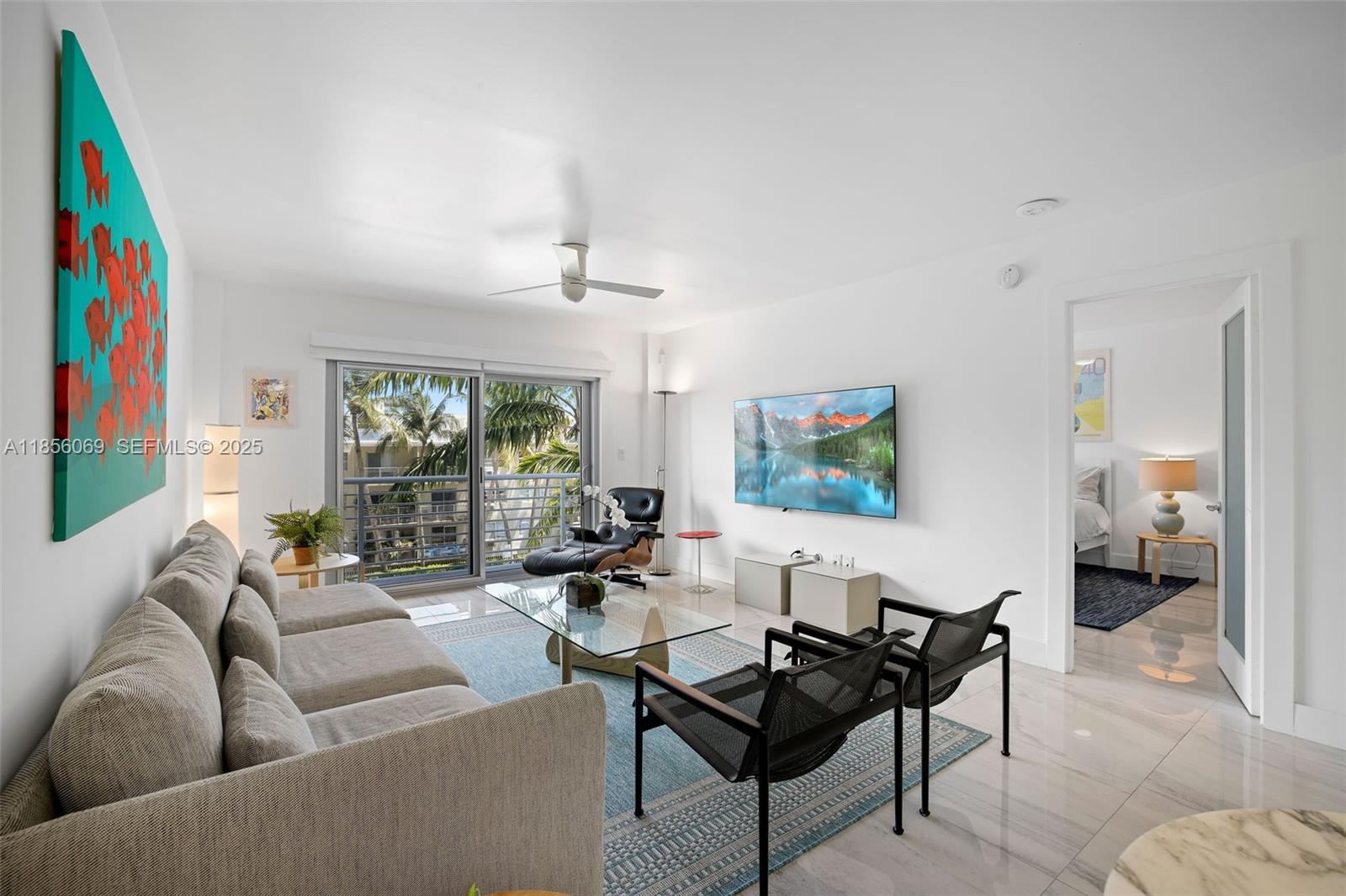1450 Lincoln Road, Unit 403 Miami Beach, FL 33139 - Photo 17 of 29 a living room with furniture and a flat screen tv