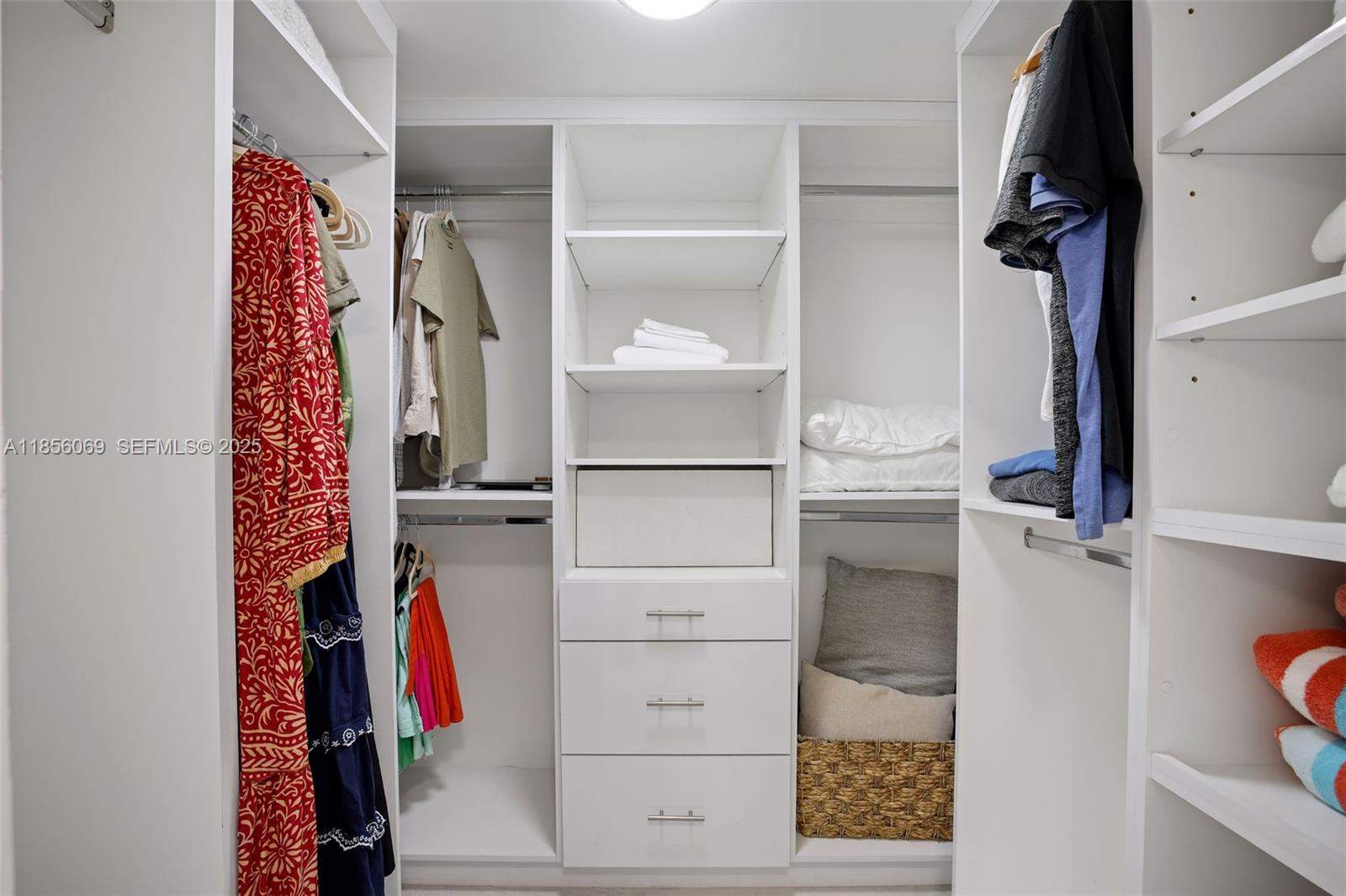 1450 Lincoln Road, Unit 403 Miami Beach, FL 33139 - Photo 24 of 29 a view of walk in closet with clothes and shoes