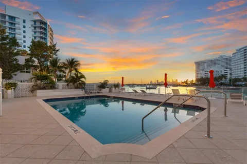 a view of outdoor space with swimming pool and seating