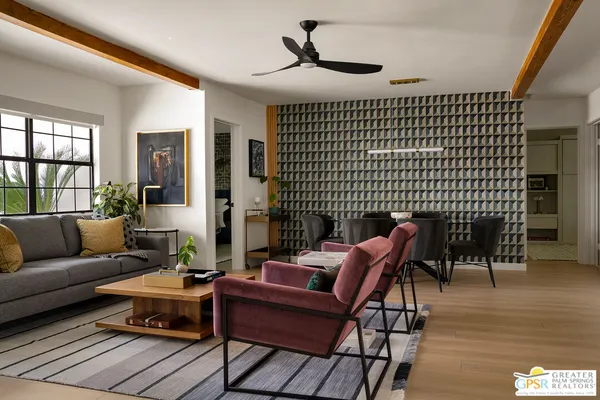 a kitchen with stainless steel appliances granite countertop a kitchen island a stove a table and chairs in it