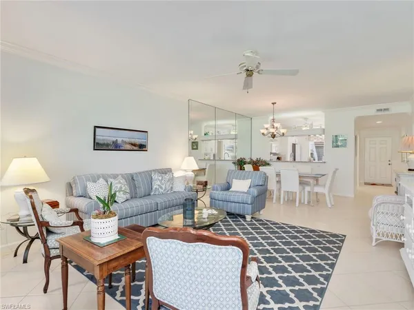 a living room with furniture and a table