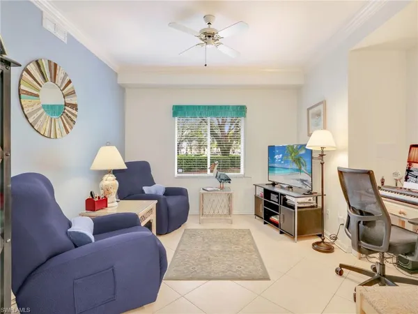 a living room with furniture and a window