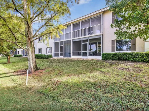 an aerial view of a house with garden space and street view