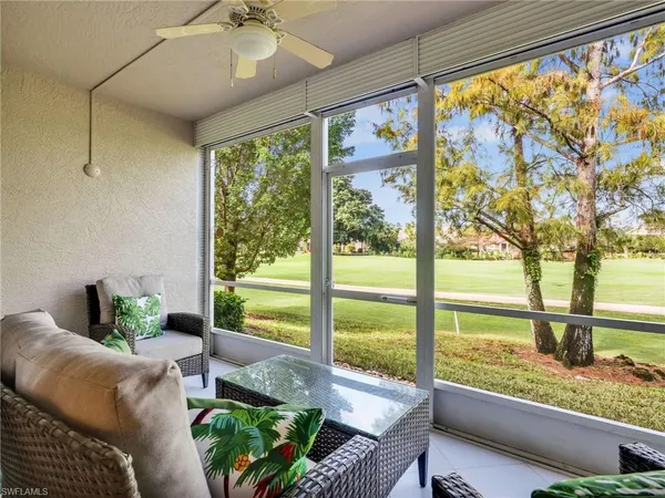 a living room with large windows