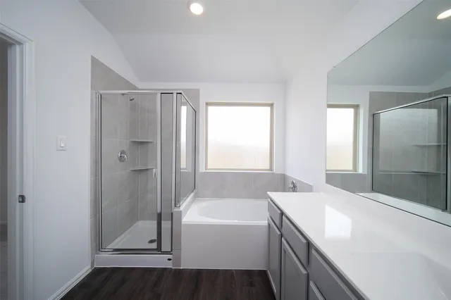 a bathroom with a bathtub and a sink