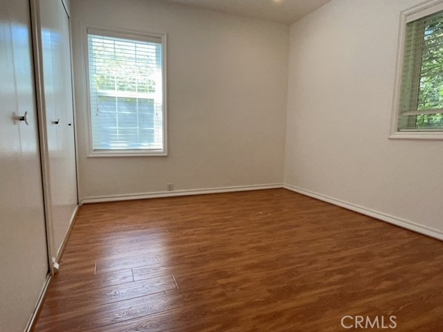 471 Woodward Boulevard Pasadena, CA 91107 - Photo 14 of 30 wooden floor in an empty room with a window