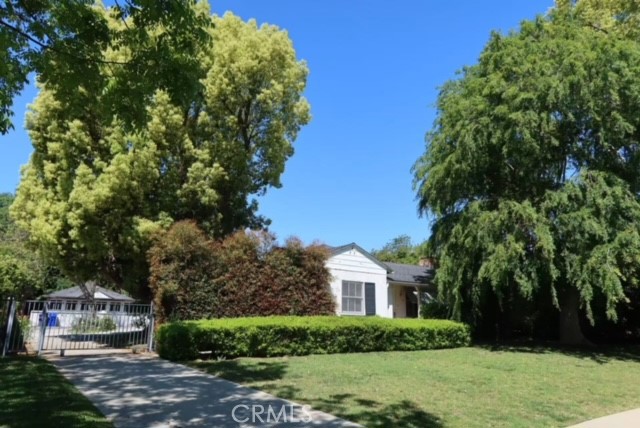 471 Woodward Boulevard Pasadena, CA 91107 - Photo 21 of 30 a front view of a house with a yard