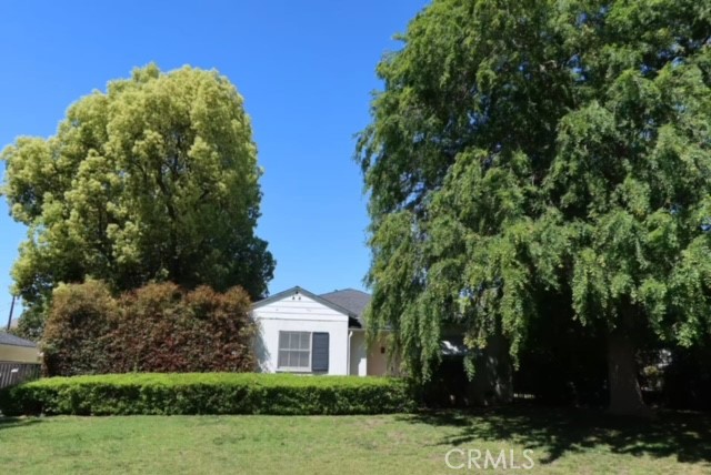 471 Woodward Boulevard Pasadena, CA 91107 - Photo 26 of 30 a view of a white house with a yard and plants
