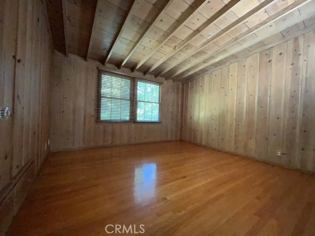 471 Woodward Boulevard Pasadena, CA 91107 - Photo 4 of 30 a view of an empty room with wooden floor and a window