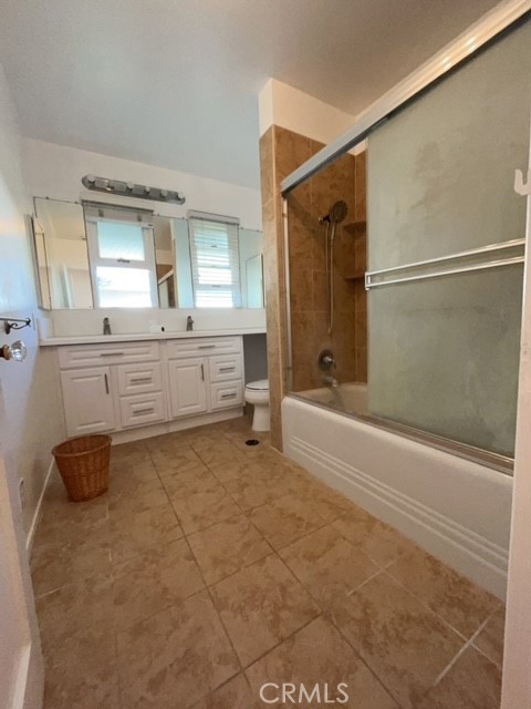 471 Woodward Boulevard Pasadena, CA 91107 - Photo 6 of 30 a spacious bathroom with a granite countertop sink a toilet and bathtub