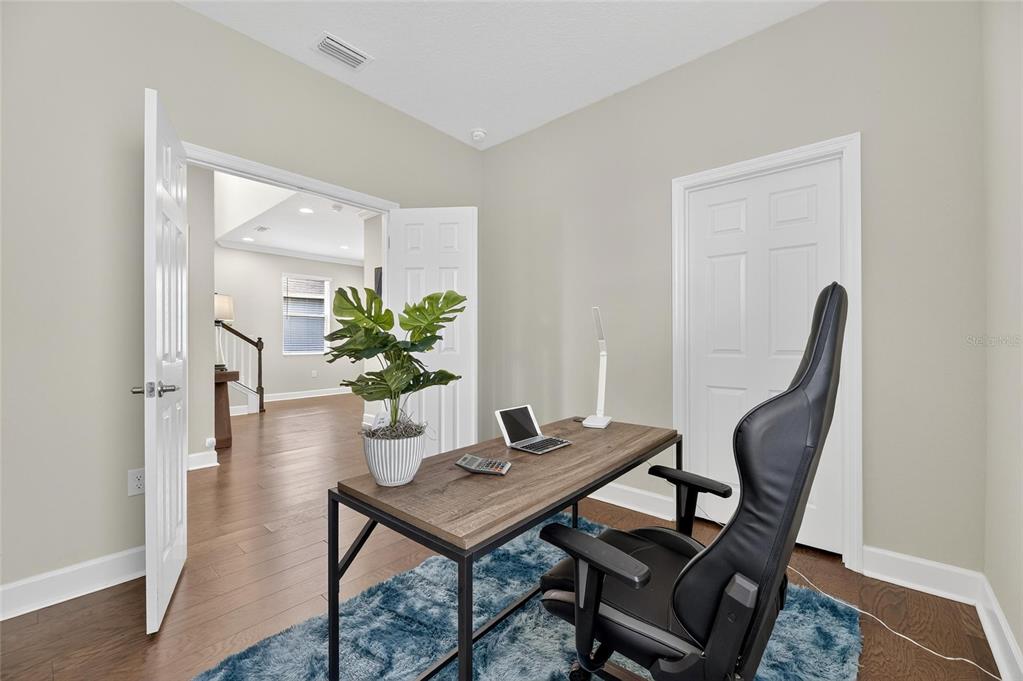 5534 Silver Sun Drive Apollo Beach, FL 33572 - Photo 13 of 76 a view of a workspace room with furniture and wooden floor