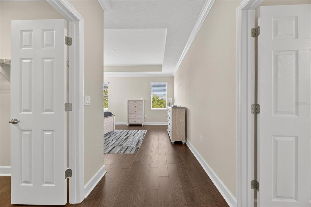 5534 Silver Sun Drive Apollo Beach, FL 33572 - Photo 26 of 76 a view of a hallway with wooden floor and closet