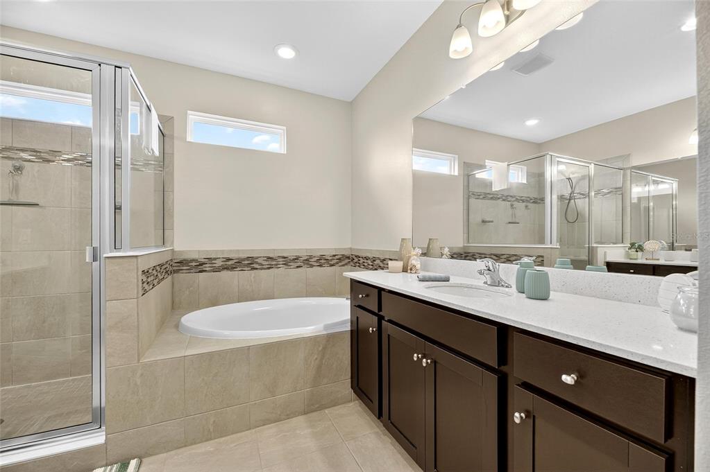 5534 Silver Sun Drive Apollo Beach, FL 33572 - Photo 28 of 76 a bathroom with a double vanity sink mirror and double