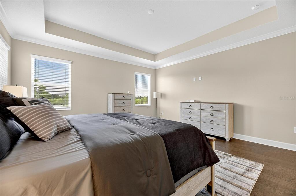 5534 Silver Sun Drive Apollo Beach, FL 33572 - Photo 33 of 76 a bedroom with a bed and wooden floor