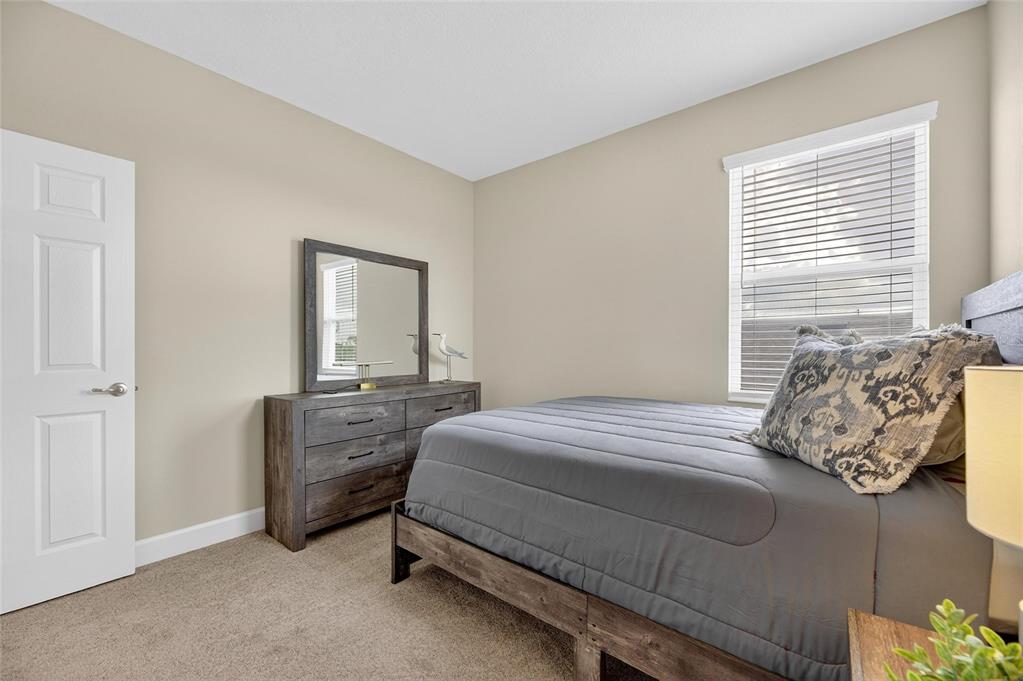 5534 Silver Sun Drive Apollo Beach, FL 33572 - Photo 38 of 76 a bedroom with a bed and a window