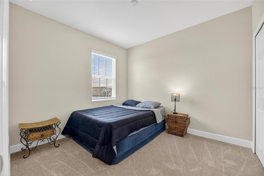 5534 Silver Sun Drive Apollo Beach, FL 33572 - Photo 39 of 76 a spacious bedroom with a bed and a window
