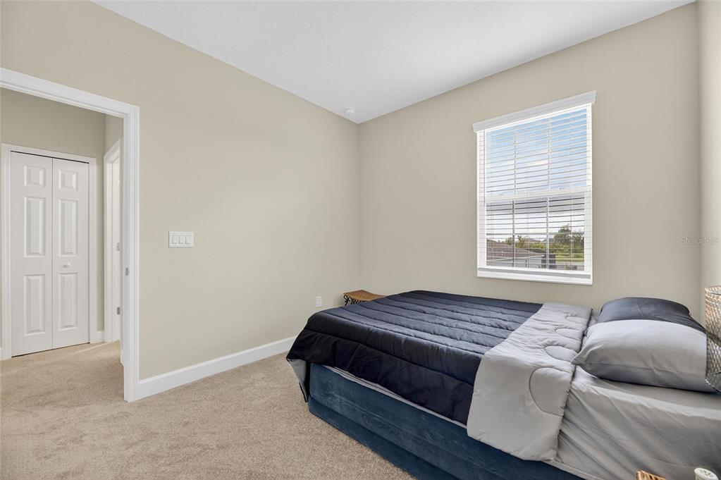 5534 Silver Sun Drive Apollo Beach, FL 33572 - Photo 41 of 76 a bedroom with a bed and a window