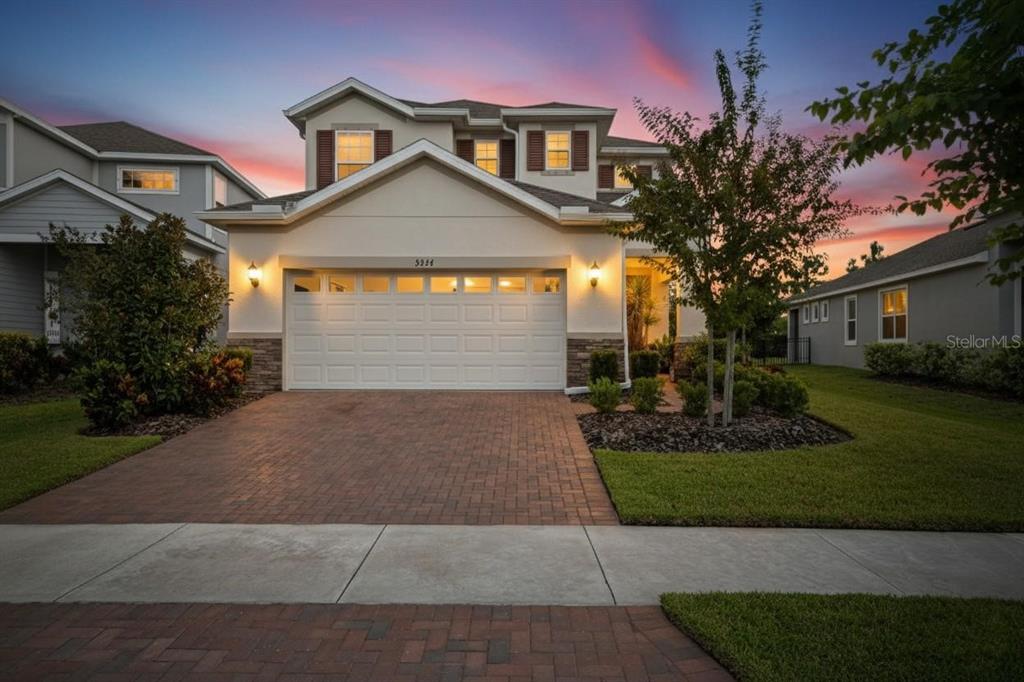 5534 Silver Sun Drive Apollo Beach, FL 33572 - Photo 5 of 76 a front view of a house with a yard and garage