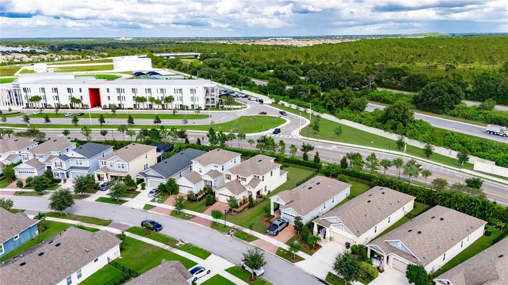 5534 Silver Sun Drive Apollo Beach, FL 33572 - Photo 51 of 76 an aerial view of multiple house with a garden and lake view