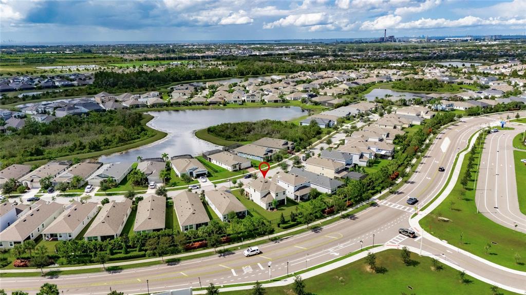 5534 Silver Sun Drive Apollo Beach, FL 33572 - Photo 54 of 76 an aerial view of residential houses with outdoor space and river