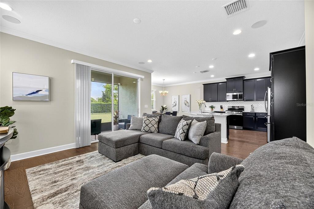 5534 Silver Sun Drive Apollo Beach, FL 33572 - Photo 8 of 76 a living room with furniture and kitchen view