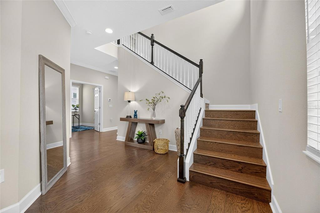 5534 Silver Sun Drive Apollo Beach, FL 33572 - Photo 9 of 76 a view of entryway and hall with wooden floor