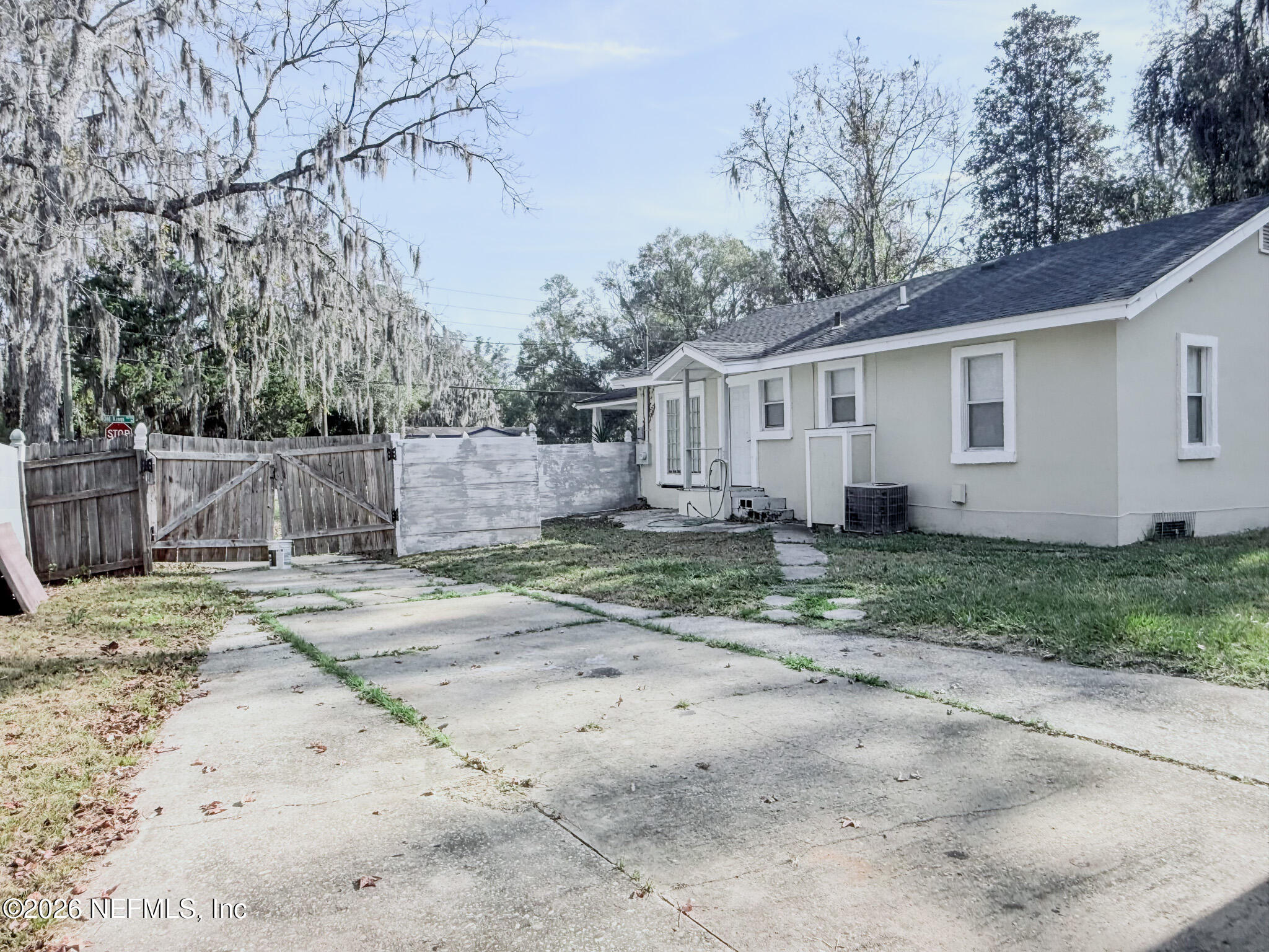 10728 Old Kings Road Jacksonville, FL 32219 - Photo 13 of 21 a view of a yard with a house and a tree