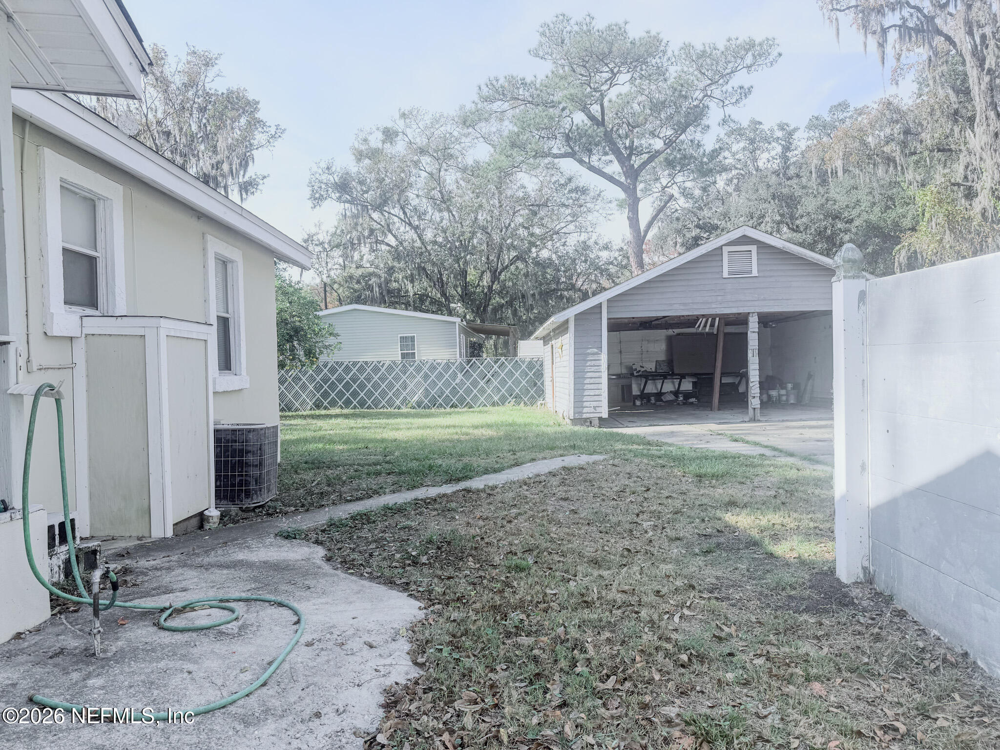 10728 Old Kings Road Jacksonville, FL 32219 - Photo 16 of 21 a front view of a house with garden