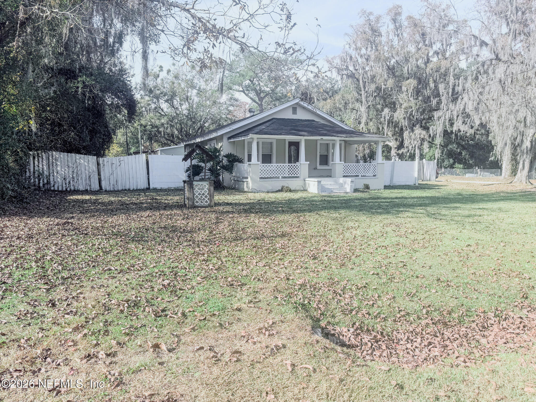 10728 Old Kings Road Jacksonville, FL 32219 - Photo 2 of 21 a front view of a house with a yard
