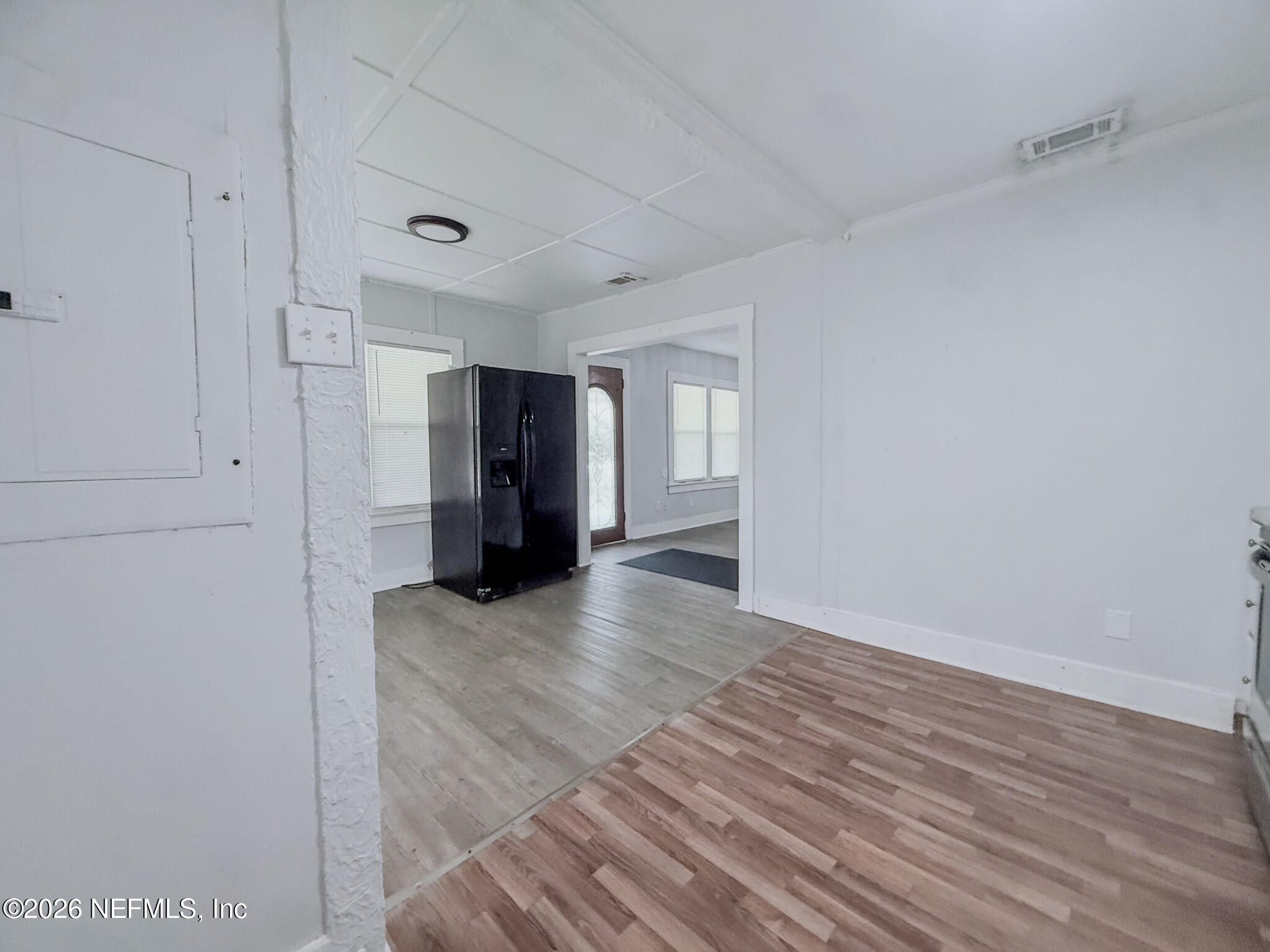 10728 Old Kings Road Jacksonville, FL 32219 - Photo 5 of 21 a view of an empty room with wooden floor and closet