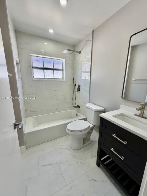 9108 Northwest 190th Terrace Hialeah, FL 33018 - Photo 3 of 10 a bathroom with a toilet a sink and bathtub