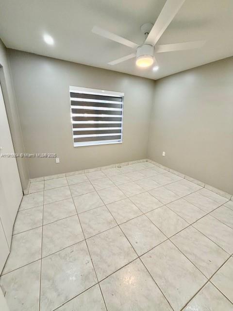 9108 Northwest 190th Terrace Hialeah, FL 33018 - Photo 9 of 10 a view of an empty room with a window