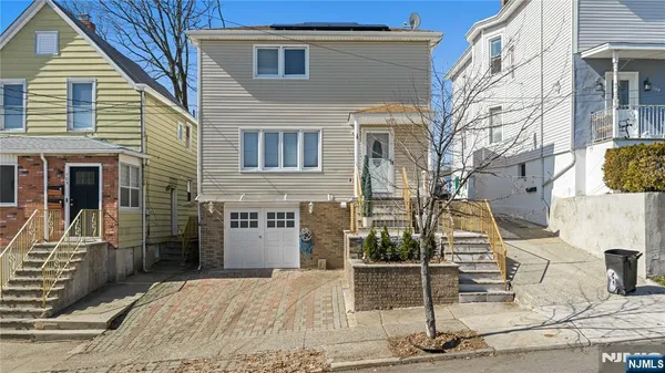 a front view of a house with parking