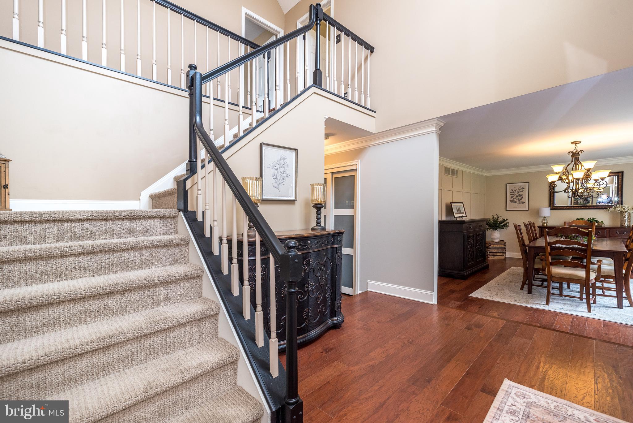 214 Broad Acres Road Lansdale, PA 19446 - Photo 5 of 65 Curved Staircase & Guest Closet
