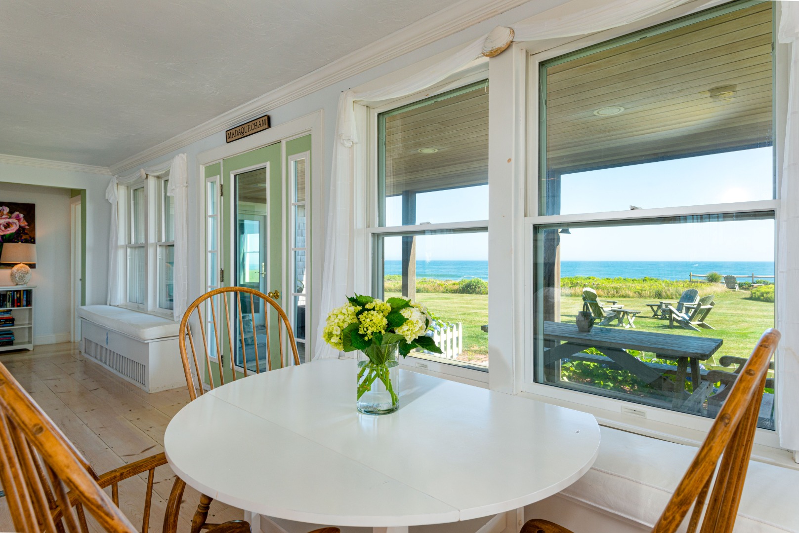 56 R Madequecham Valley Road Nantucket, MA 02554 - Photo 24 of 52 a view of a dining room with furniture window and wooden floor