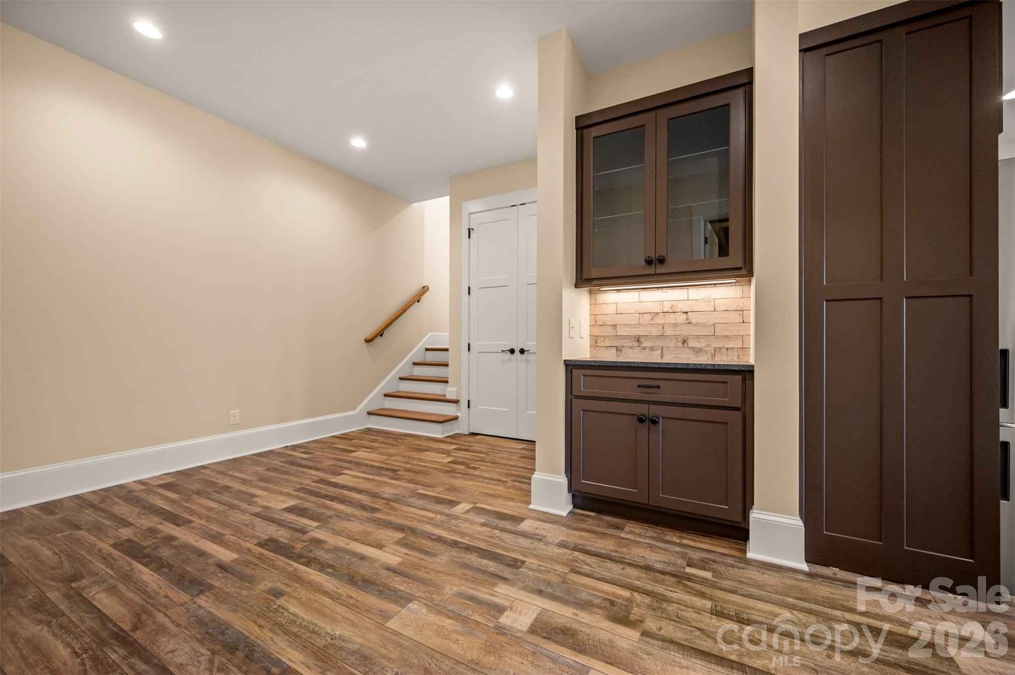 297 Mountain Meadows Lane, Unit 7 Tryon, NC 28782 - Photo 32 of 47 a view of a hallway with wooden floor and entryway