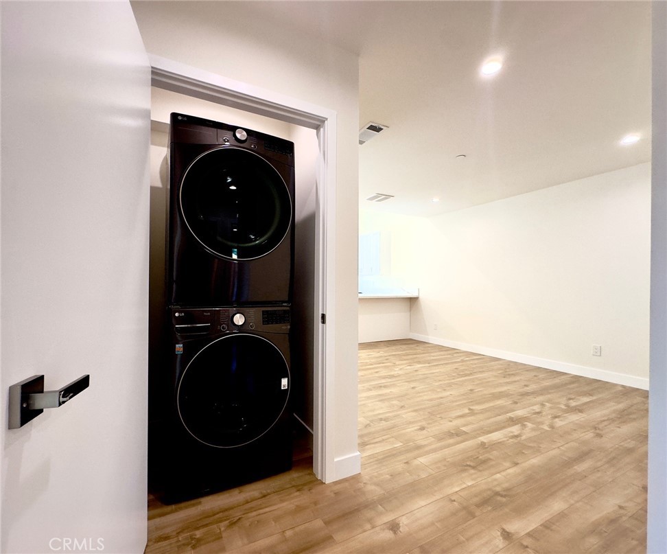 15952 Cohasset Street Van Nuys, CA 91406 - Photo 6 of 11 a view of a living room with a washer and dryer