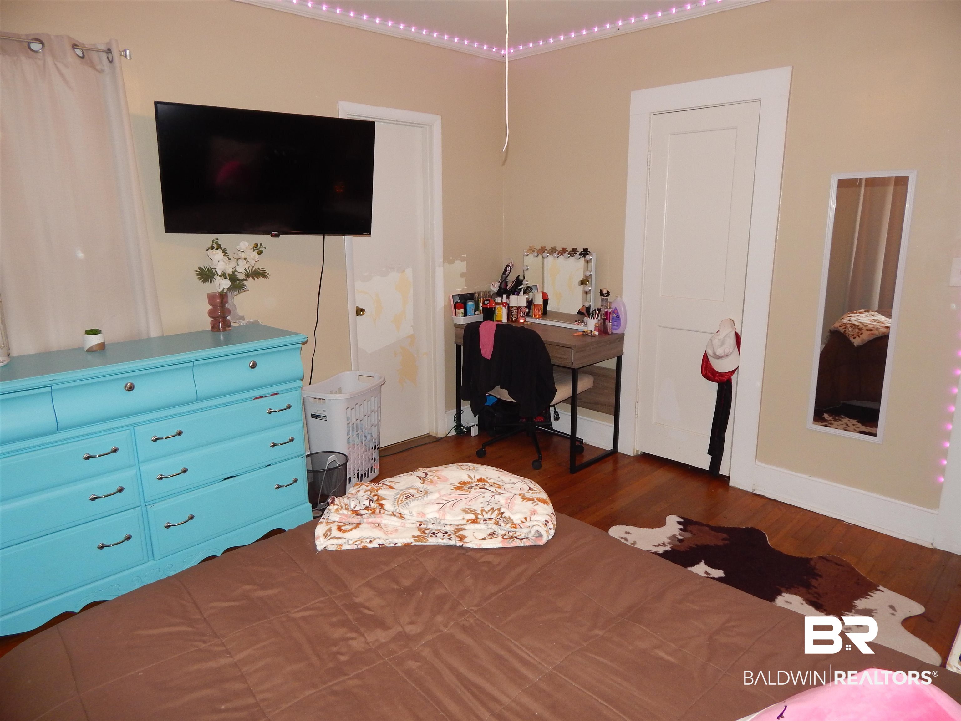 309 Bellview Avenue Evergreen, AL 36401 - Photo 17 of 27 Bedroom with wood finished floors