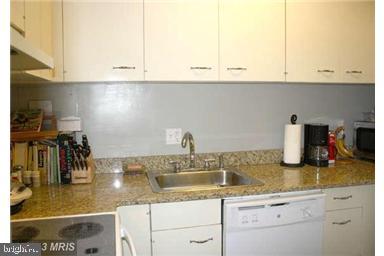 1800 R Street Northwest, Unit 604 Washington, DC 20009 - Photo 8 of 17 Modern kitchen with sleek finishes.