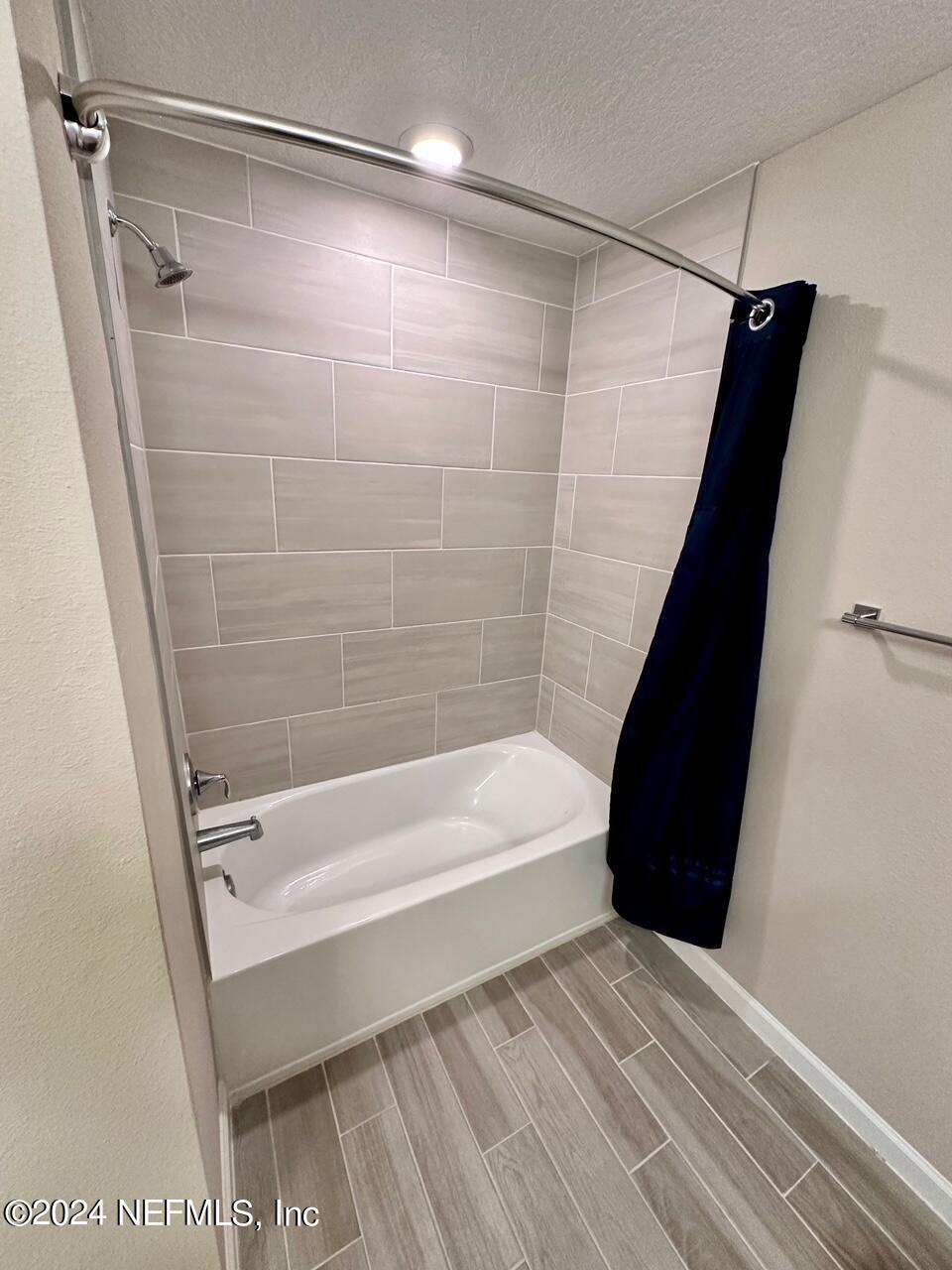 435 Boracay Circle St. Johns, FL 32259 - Photo 12 of 31 a bathroom with a bathtub and a shower