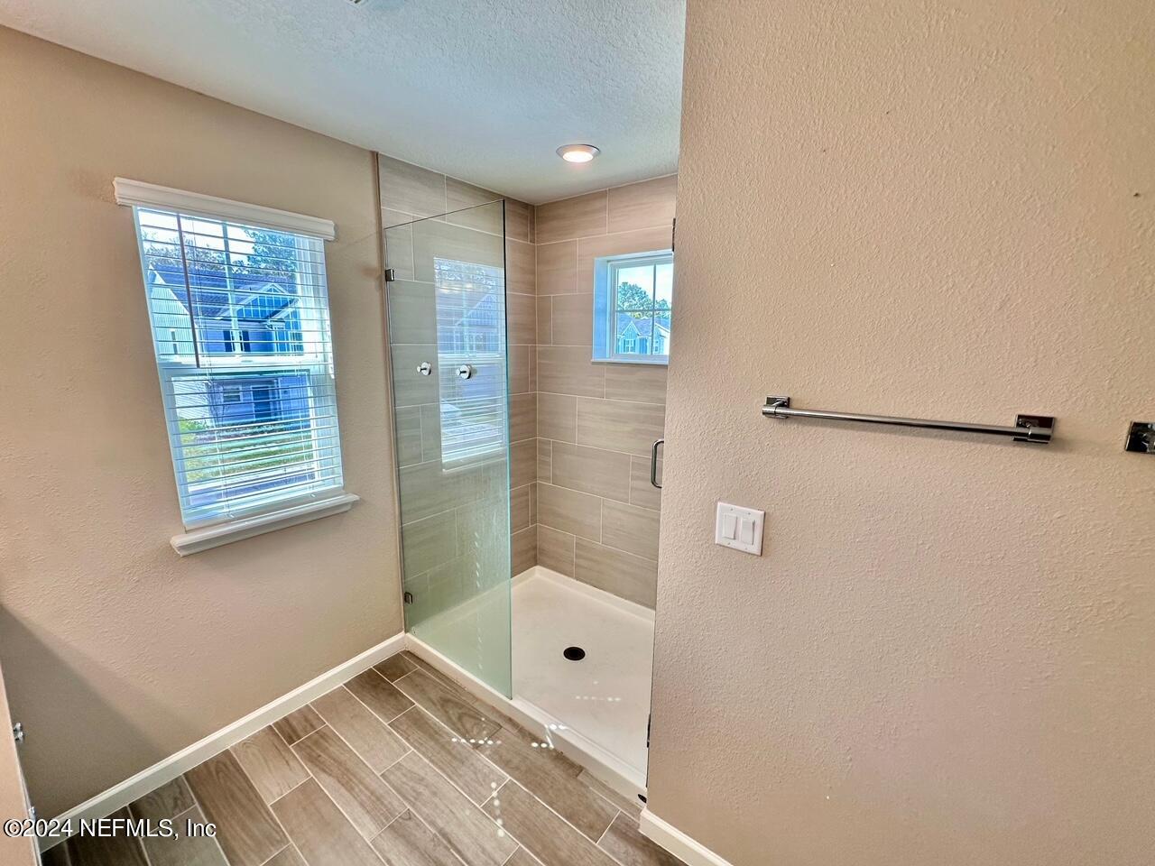 435 Boracay Circle St. Johns, FL 32259 - Photo 18 of 31 a bathroom with a bathtub and shower