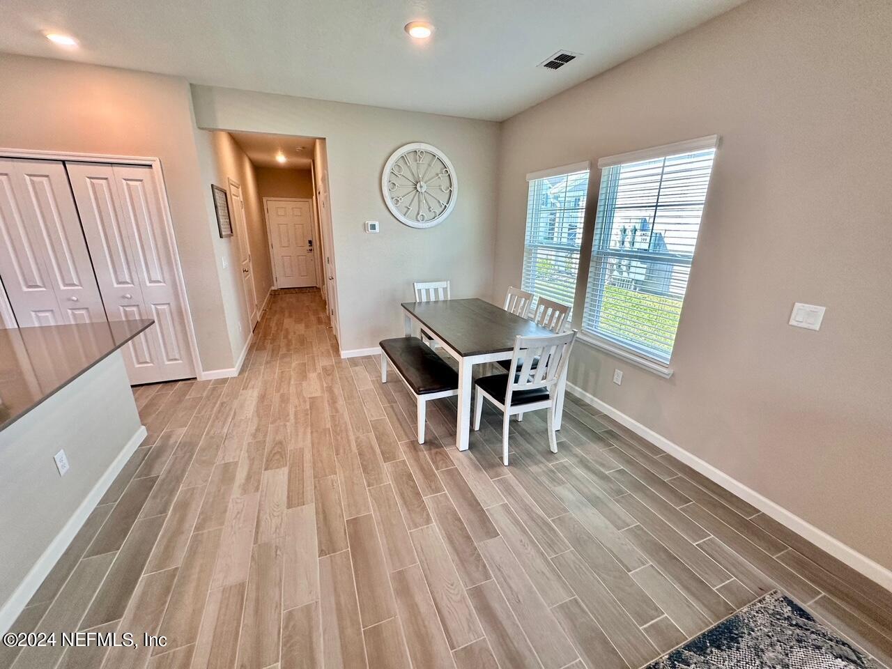 435 Boracay Circle St. Johns, FL 32259 - Photo 6 of 31 a dining room with wooden floor and a window
