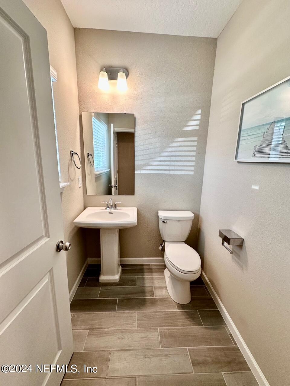 435 Boracay Circle St. Johns, FL 32259 - Photo 8 of 31 a bathroom with a sink toilet and mirror