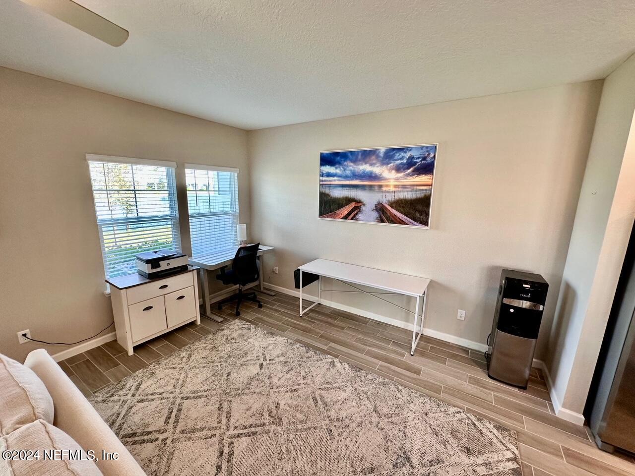 435 Boracay Circle St. Johns, FL 32259 - Photo 10 of 31 a spacious bedroom with a bed and a couch