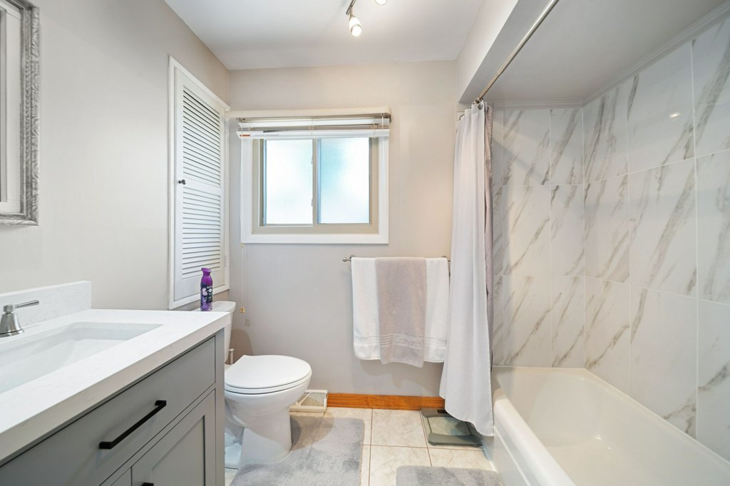 365 West Myrick Avenue Addison, IL 60101 - Photo 22 of 49 a bathroom with a sink toilet and shower