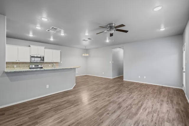 a view of kitchen with wooden floor and window