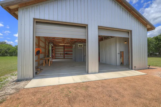 a view of a wooden door and a room