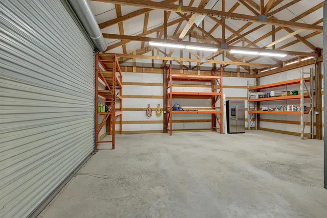 a view of a room with furniture and a window