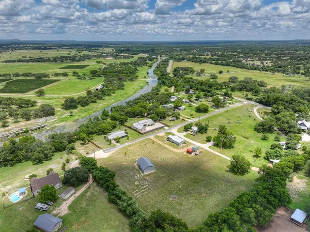 a view of a building with a field